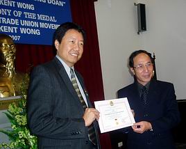 Kent Wong recieves award from Vietnamese communist labor leader Nguyen Hoa Binh, 2007
