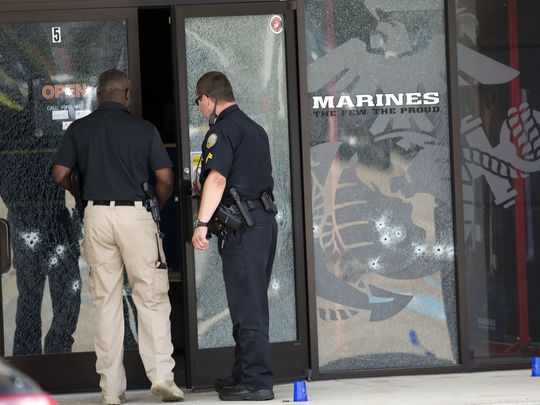 The bullet-riddled door of Marine recruiting office after Islamic radical opened fire on the building July 16 in Chattanooga, Tenn.