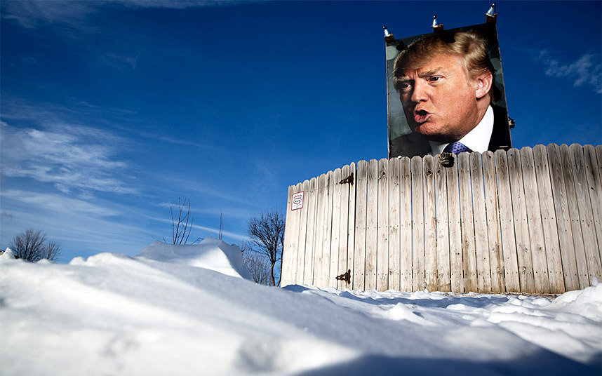 Snow blankets the ground around a picture of U.S. Republican presidential candidate Donald Trump displayed outside