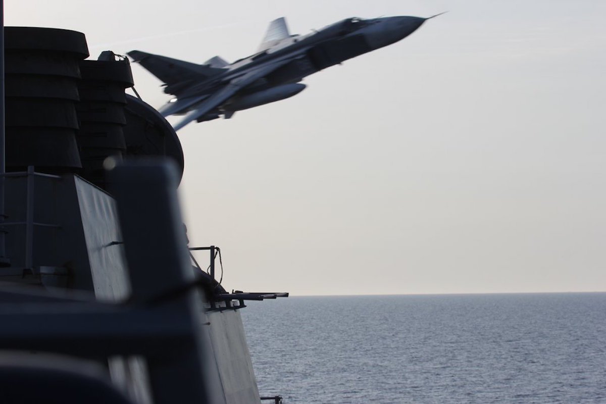 "The repeated flights by the Sukhoi SU-24 warplanes, which also flew near the ship a day earlier, were so close they created wake in the water, with 11 passes, the official said." - Business Insider