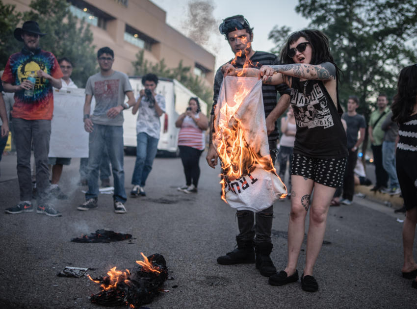Chelsea Rae Gray(cq) of Albuquerque burns a Donald Trump T-shirt Albuquerque, New Mexico (Albuquerque Journal)