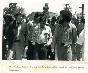 Tom Hayden, Cesar Chavez (United Farmworkers Union), and Ken Msemaji (Nia Cultural Organization) leading the march of the 10th annual Malcolm X Kuzaliwa (birthday) celebration, May 1977